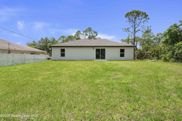 1035 Flintlock Ave SE, Palm Bay, FL 32909 - back of property with stucco siding