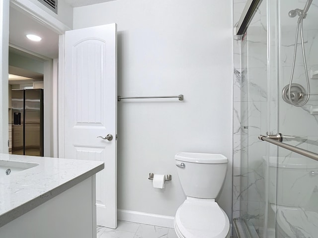 full bathroom with a marble finish shower, baseboards, toilet, marble finish floor, and vanity