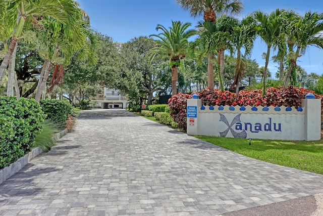 view of property's community featuring decorative driveway