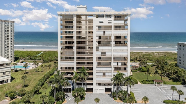 view of property featuring a water view and a view of the beach