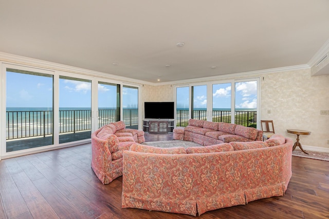 living room with crown molding, baseboards, dark wood-style flooring, and a water view