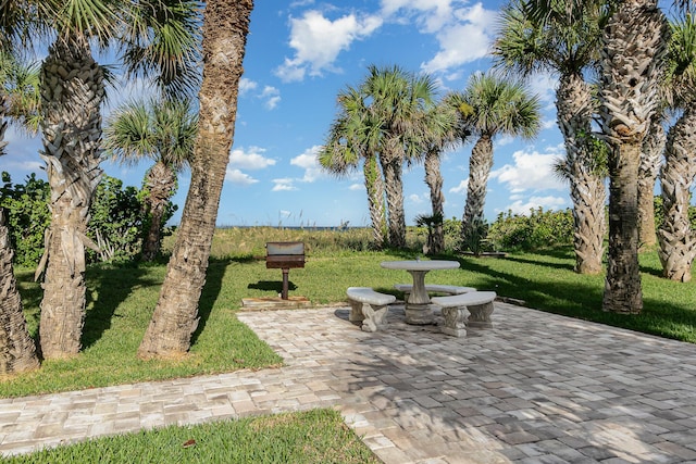 view of community with a patio and a yard