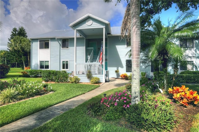 9635 Riverside Dr Unit 3, Sebastian, FL 32958 - view of front of house with a front yard