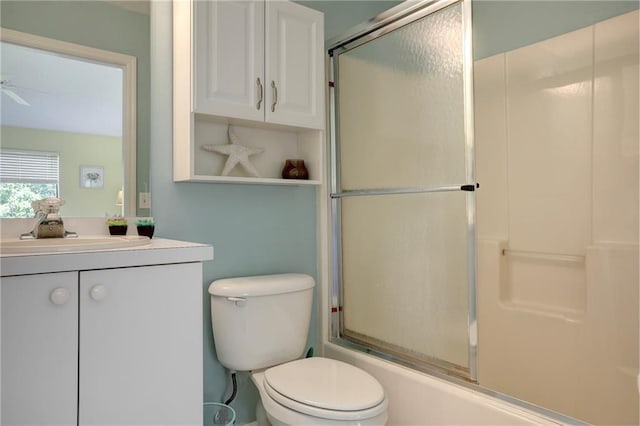 9635 Riverside Dr Unit 3, Sebastian, FL 32958 - full bathroom featuring bath / shower combo with glass door, ceiling fan, vanity, and toilet
