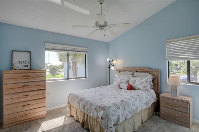 9635 Riverside Dr Unit 3, Sebastian, FL 32958 - bedroom with multiple windows, light colored carpet, lofted ceiling, and ceiling fan
