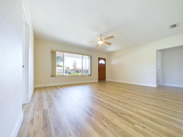 unfurnished living room with ceiling fan and light hardwood / wood-style flooring