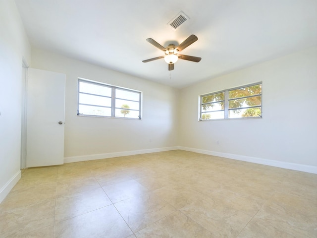 spare room with ceiling fan