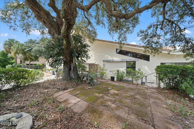 exterior space featuring a patio area and fence