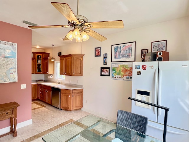 kitchen with light tile patterned flooring, ceiling fan, hanging light fixtures, white refrigerator with ice dispenser, and dishwasher