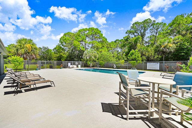 view of swimming pool featuring a patio area