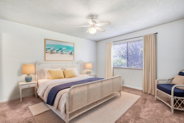 carpeted bedroom featuring a textured ceiling and ceiling fan