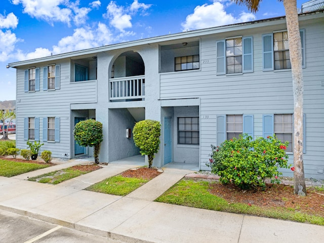 townhome / multi-family property with a balcony