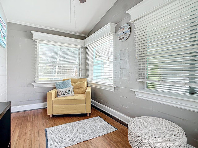 sitting room with hardwood / wood-style flooring, lofted ceiling, and ceiling fan