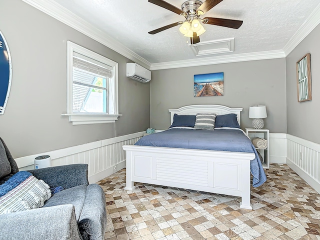 bedroom featuring ornamental molding, ceiling fan, a textured ceiling, and a wall unit AC