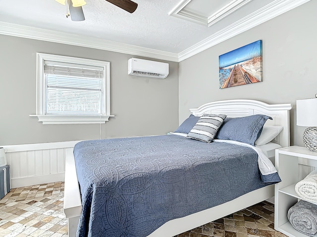 bedroom with crown molding, ceiling fan, a textured ceiling, and a wall unit AC