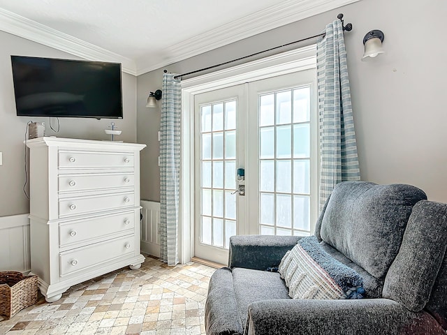 sitting room featuring french doors and ornamental molding