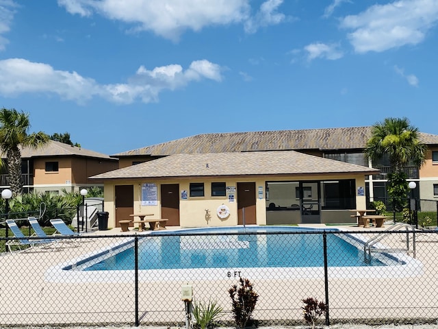 view of pool with a patio area and a sunroom