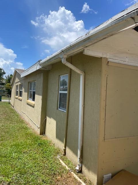 view of home's exterior featuring a yard