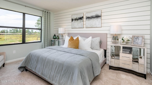 bedroom with light colored carpet