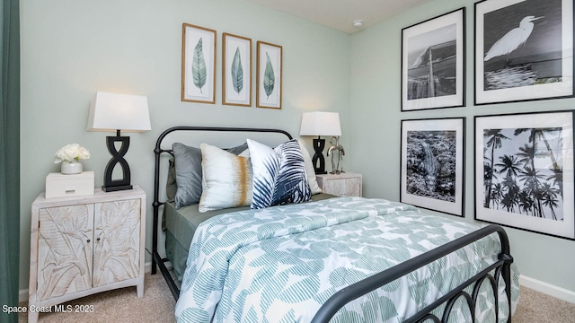 bedroom featuring light carpet