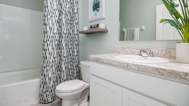 full bathroom with toilet, tiled shower / bath, and vanity