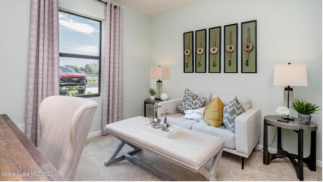 living room featuring light carpet and plenty of natural light