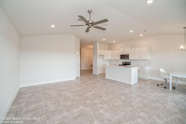 2283 Middlebury Dr SE, Palm Bay, FL 32909 - interior space with a sink, stainless steel appliances, ceiling fan with notable chandelier, white cabinetry, and light countertops