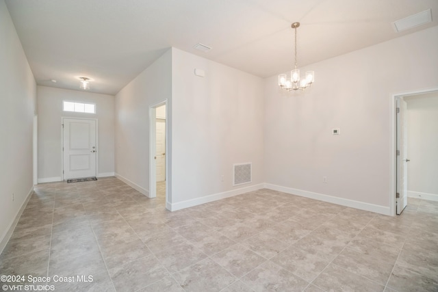 2283 Middlebury Dr SE, Palm Bay, FL 32909 - entryway featuring baseboards, a chandelier, visible vents, and light tile patterned flooring