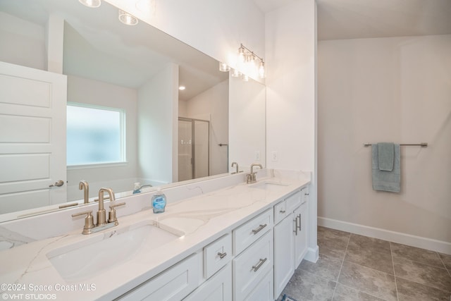 2283 Middlebury Dr SE, Palm Bay, FL 32909 - bathroom with baseboards, double vanity, a sink, and a shower stall