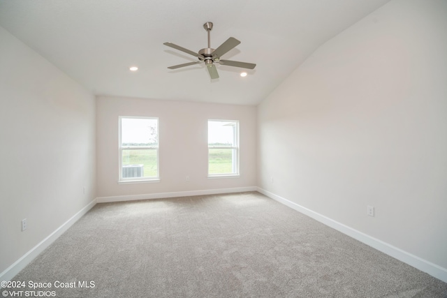 unfurnished room with recessed lighting, lofted ceiling, a ceiling fan, carpet flooring, and baseboards