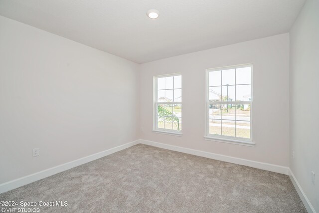2283 Middlebury Dr SE, Palm Bay, FL 32909 - empty room with baseboards and carpet flooring