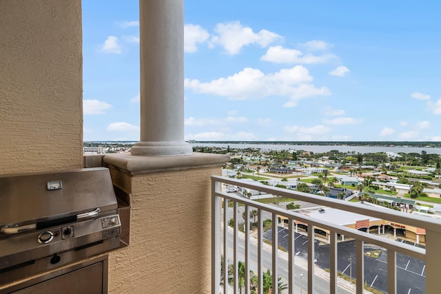 balcony featuring a water view