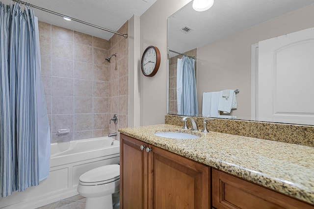 full bathroom featuring visible vents, shower / bath combination with curtain, a textured ceiling, tile patterned flooring, and vanity