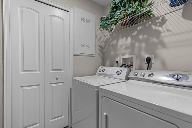 washroom featuring laundry area and washer and dryer