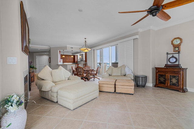 living room with light tile patterned floors, ornamental molding, and ceiling fan