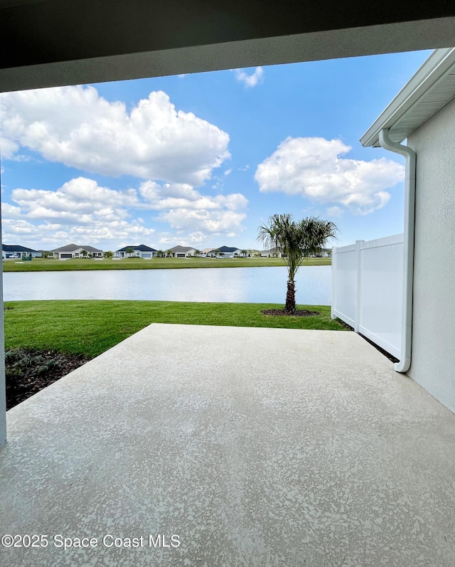 view of patio with a water view