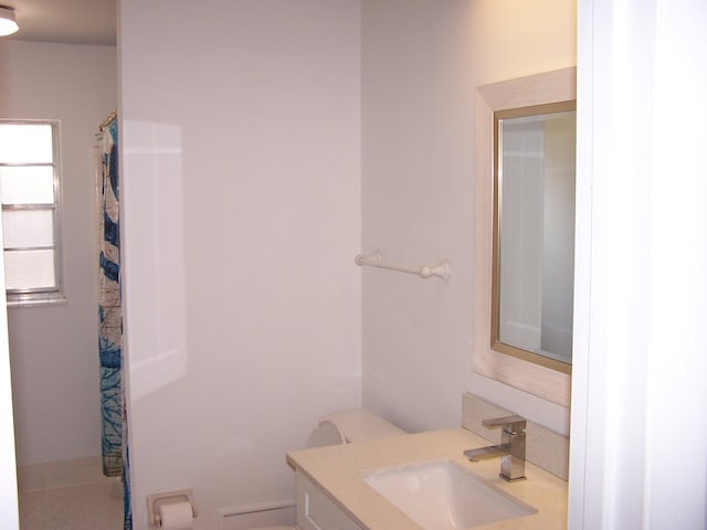 bathroom featuring vanity and a shower with curtain