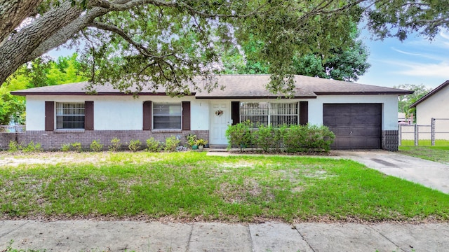 single story home with a garage and a front yard