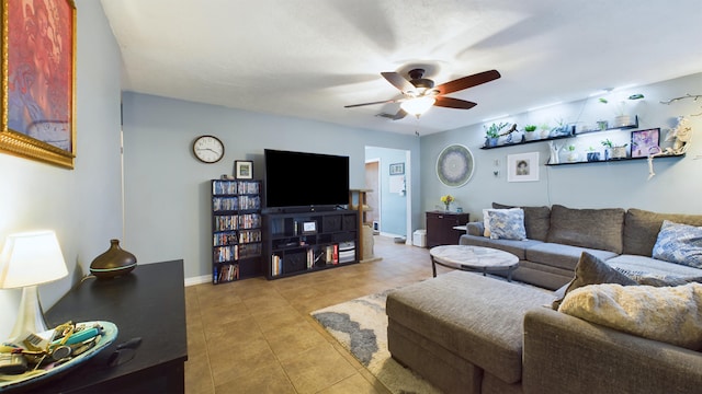 tiled living room featuring ceiling fan