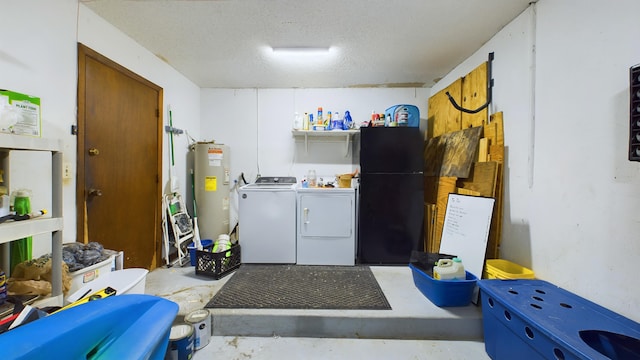 washroom with independent washer and dryer, electric water heater, and a textured ceiling