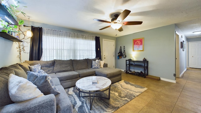 tiled living room featuring ceiling fan