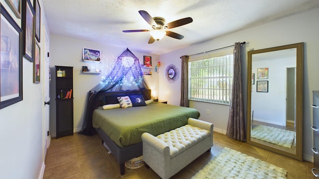 tiled bedroom featuring ceiling fan