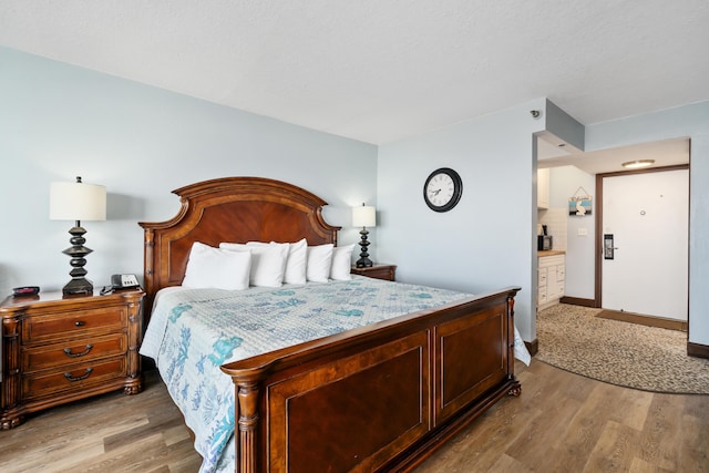 bedroom with light hardwood / wood-style flooring