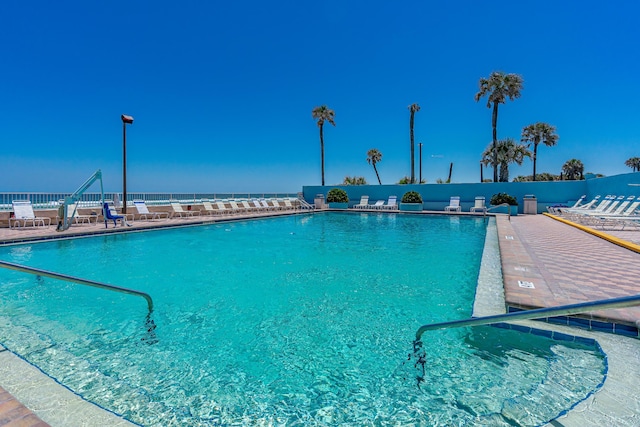 view of pool featuring a water view