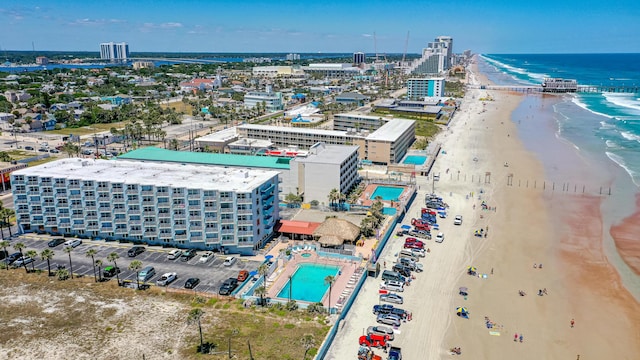 aerial view featuring a view of the beach and a water view