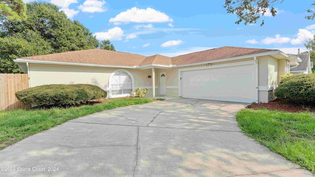 ranch-style home featuring a garage