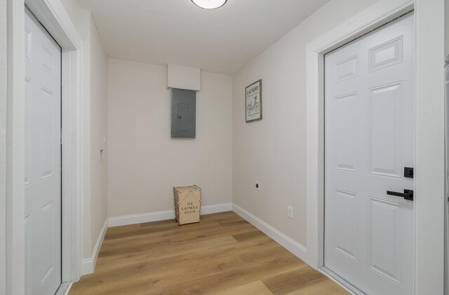 interior space with light hardwood / wood-style floors, electric panel, and electric dryer hookup