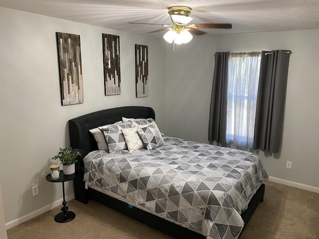 bedroom featuring ceiling fan and carpet floors