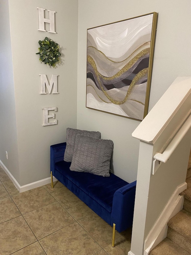 living area with tile patterned floors