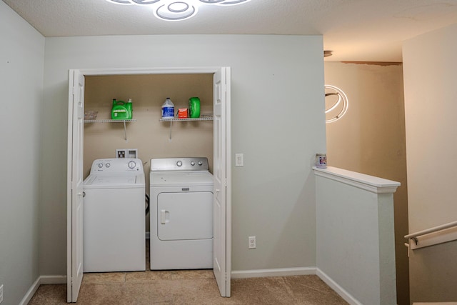 laundry area featuring separate washer and dryer and light colored carpet